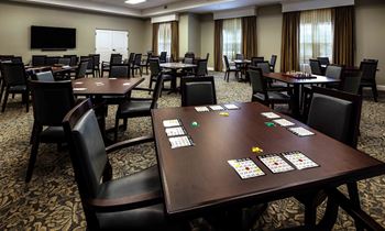 a room filled with lots of tables and chairs at Arbor Hills, Florida, 33805